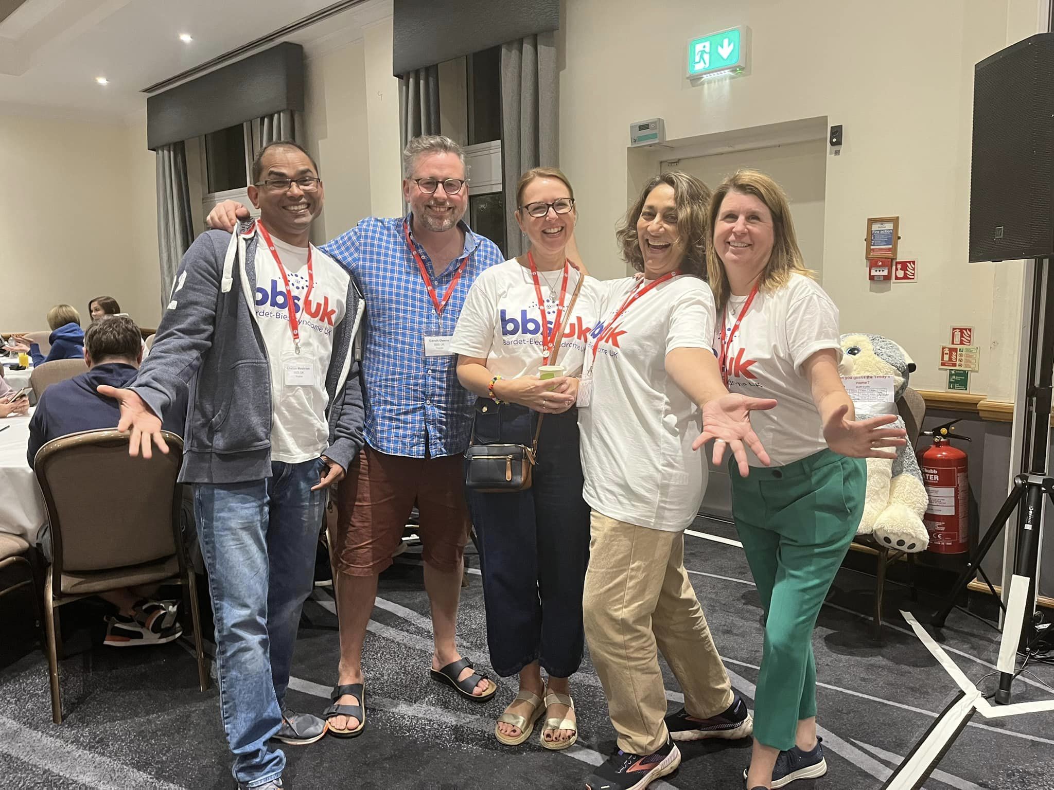 Five people are stood together smiling at the camera. Four of them are wearing BBS UK t-shirts.