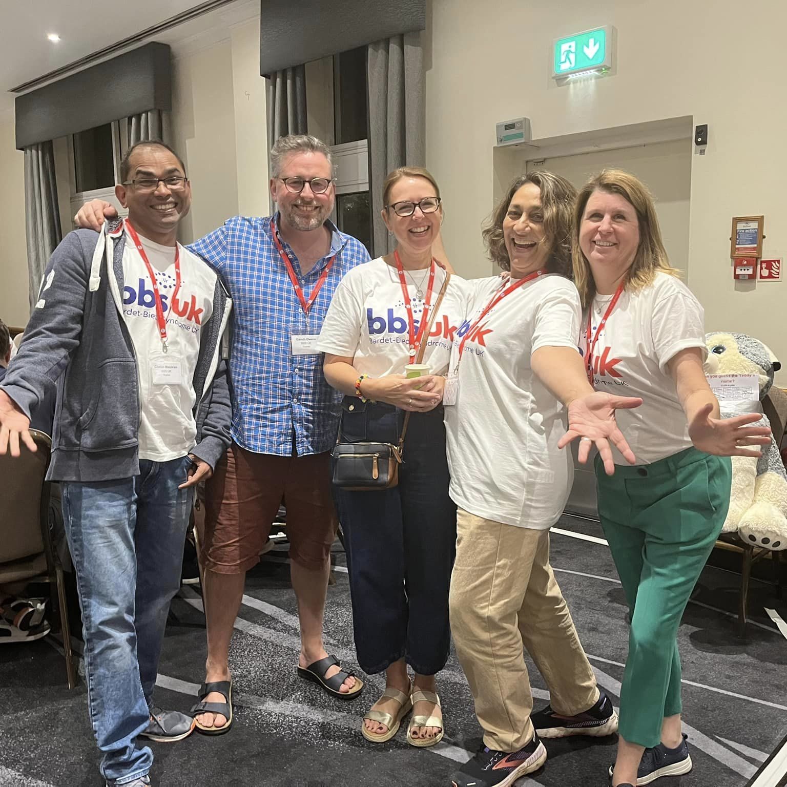 Five people are stood together smiling at the camera. Four of them are wearing BBS UK t-shirts.