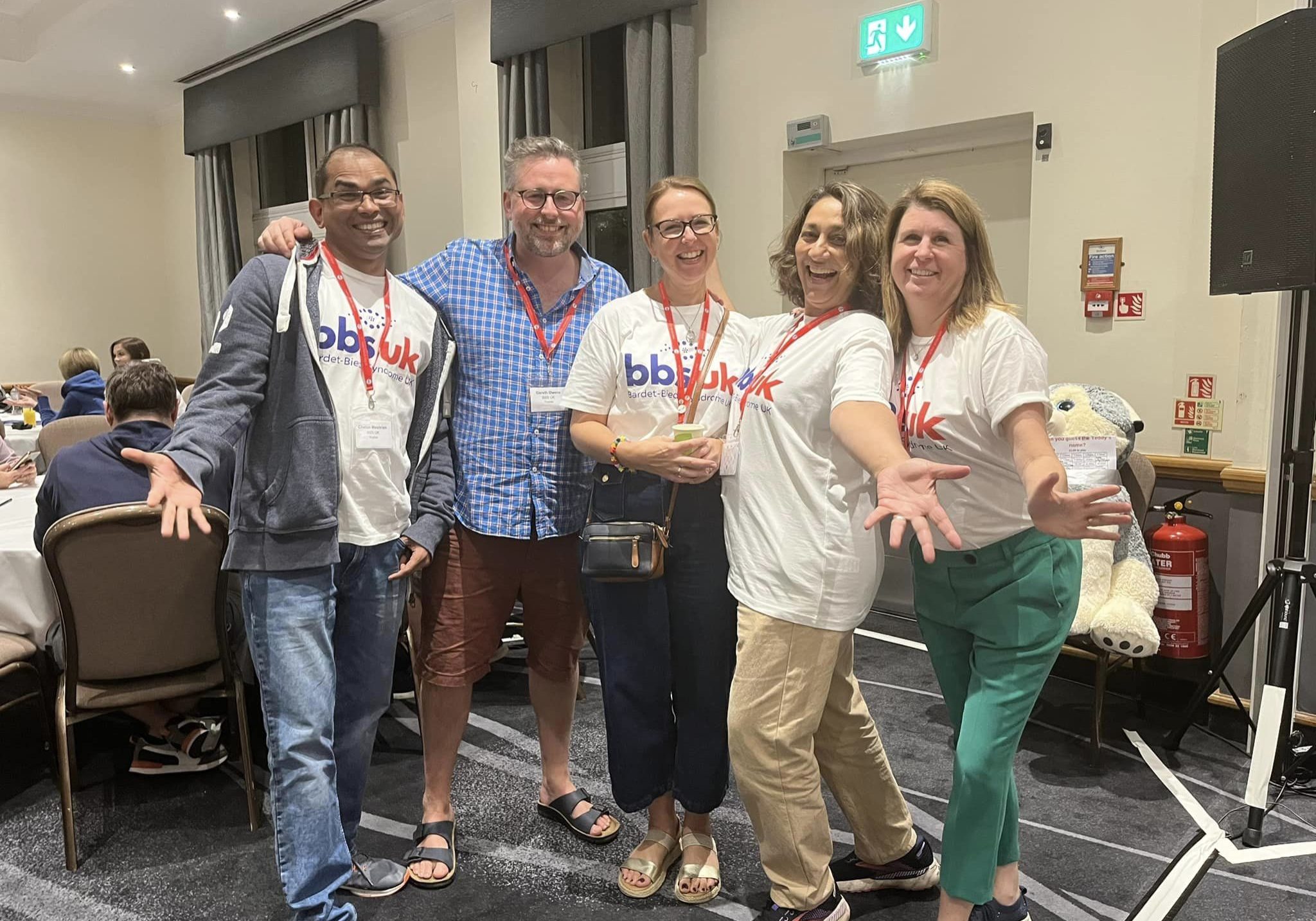 Five people are stood together smiling at the camera. Four of them are wearing BBS UK t-shirts.